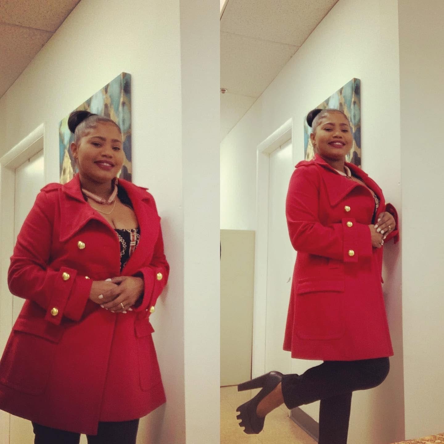 Dr. Loriane Clarke in a red executive coat